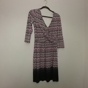 A 3/4 sleeve purple and black dress